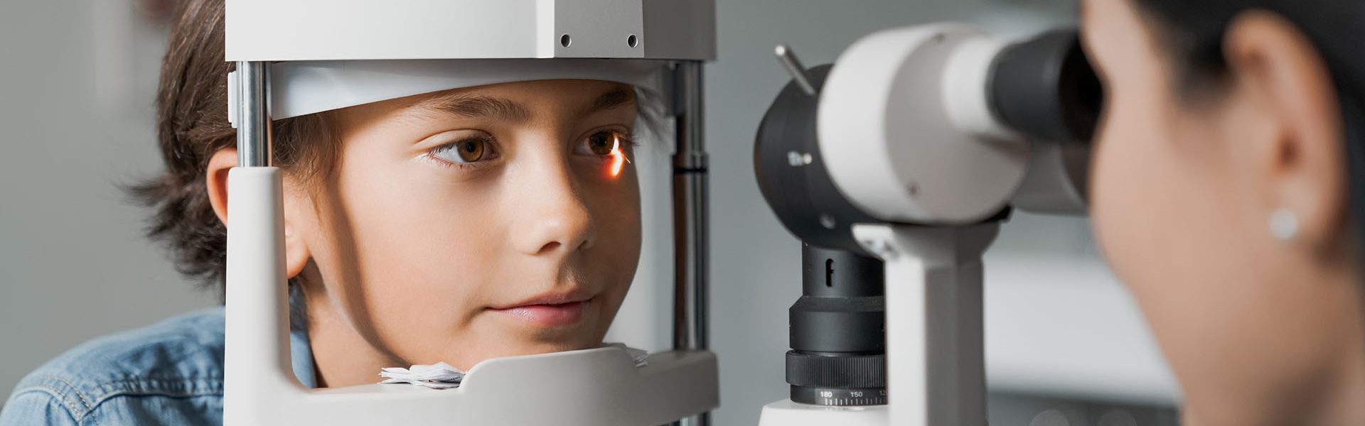 Adult female doctor ophthalmologist is checking the eye vision of cute child in modern clinic Eye Exam, Child, Medical Exam, Eye Test Equipment, Ophthalmologist